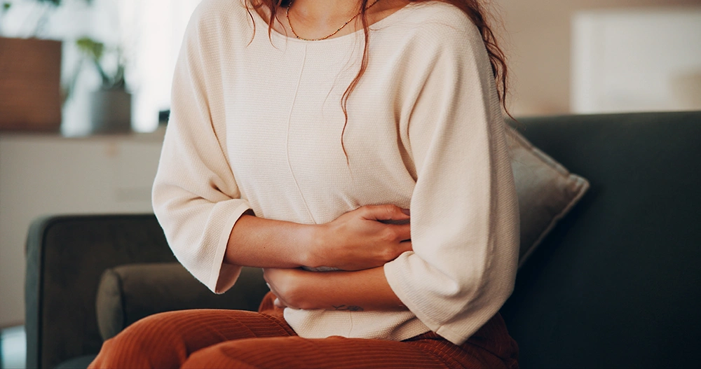 A woman experiencing discomfort due to endometriosis