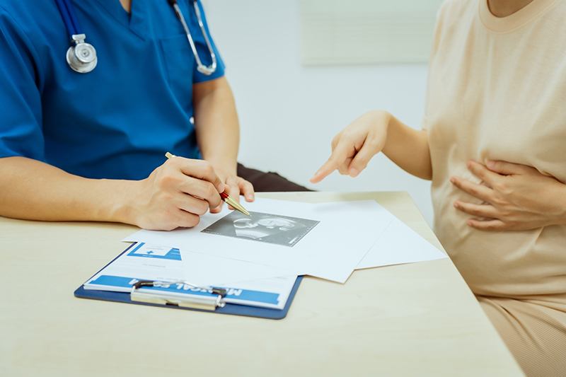 A woman consulting an OB-GYN doctor